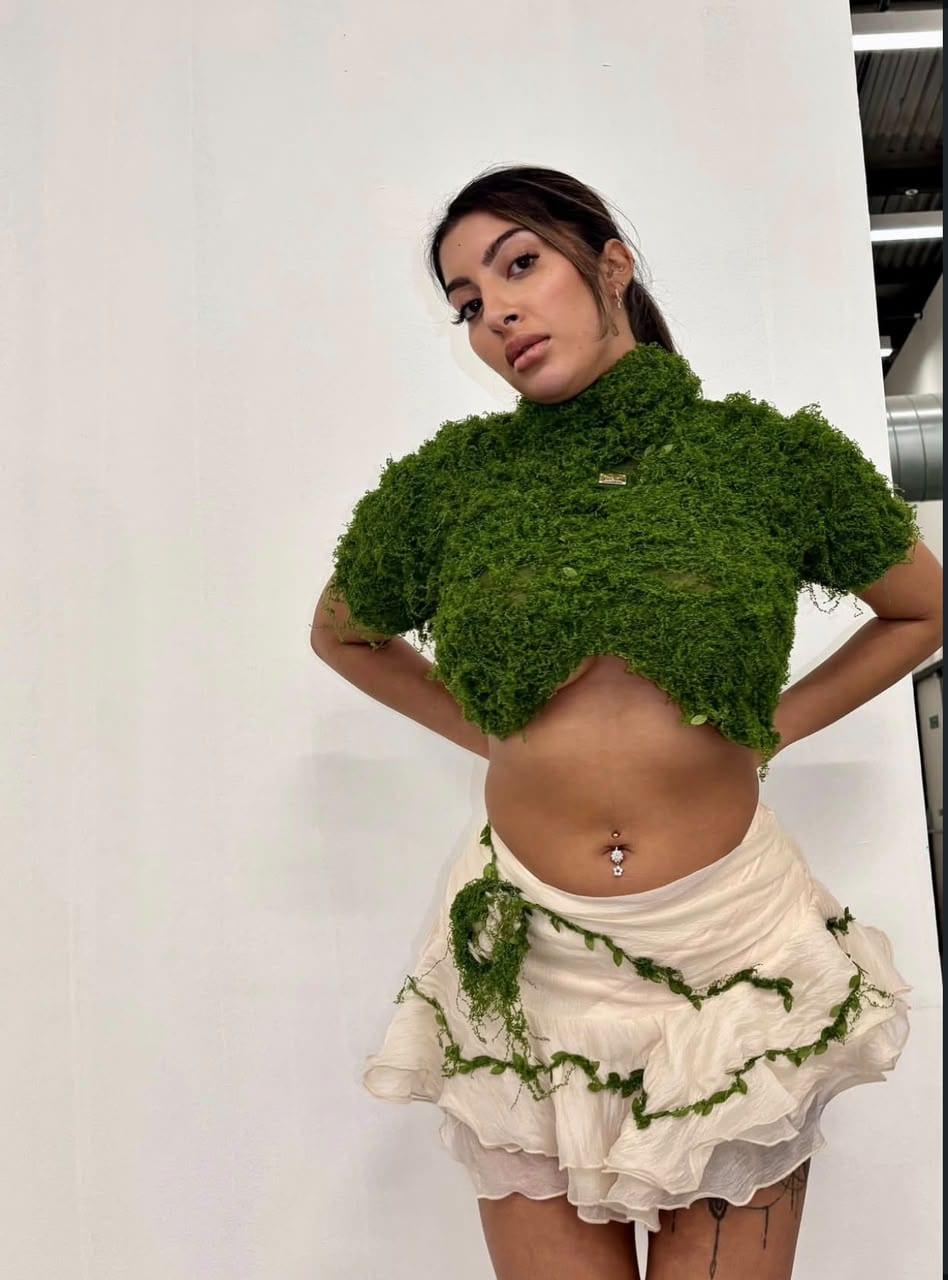 Moss-green textured crop top styled with a cream ruffled skirt