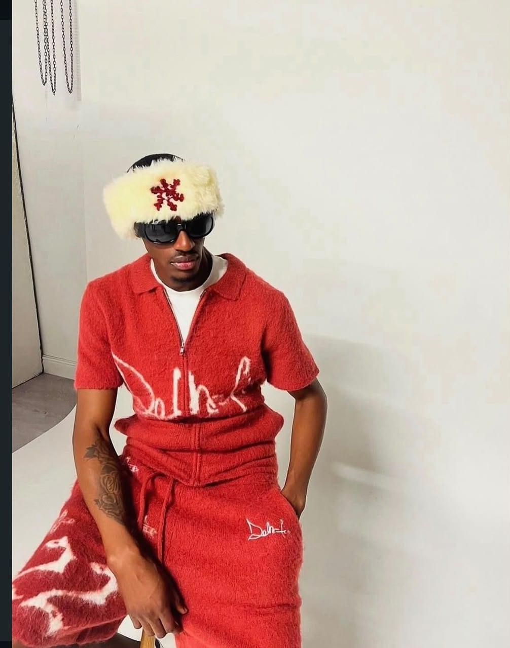 Crimson Dela-Fin logo tracksuit styled with a faux fur trapper hat