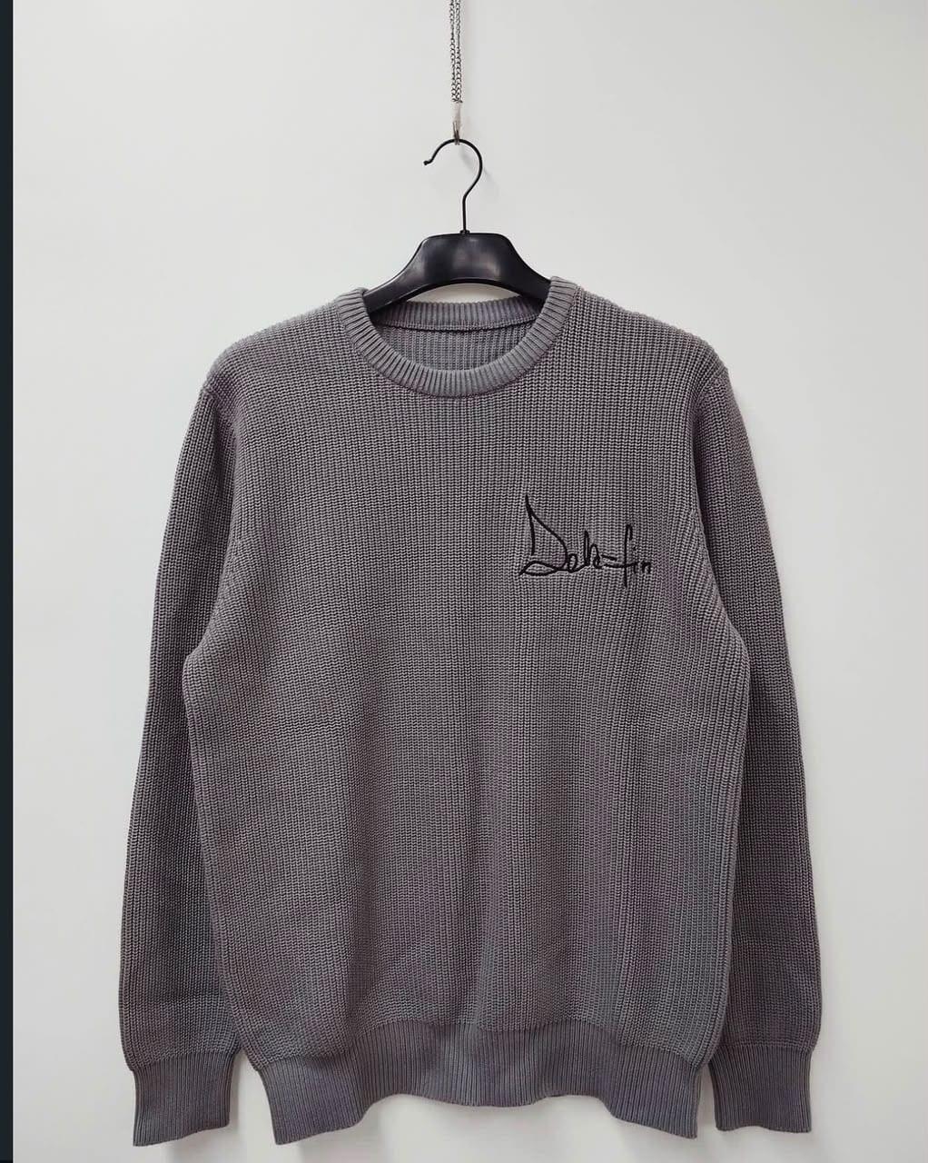 Grey knit sweater with embroidered Dela-Fin script logo, on hanger