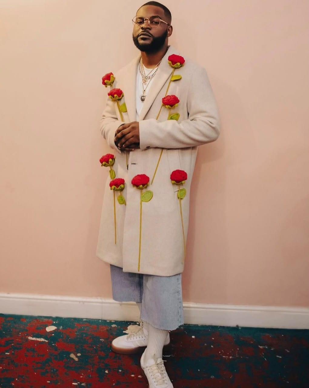 Full-length view of the custom overcoat with hand-crocheted 3D roses