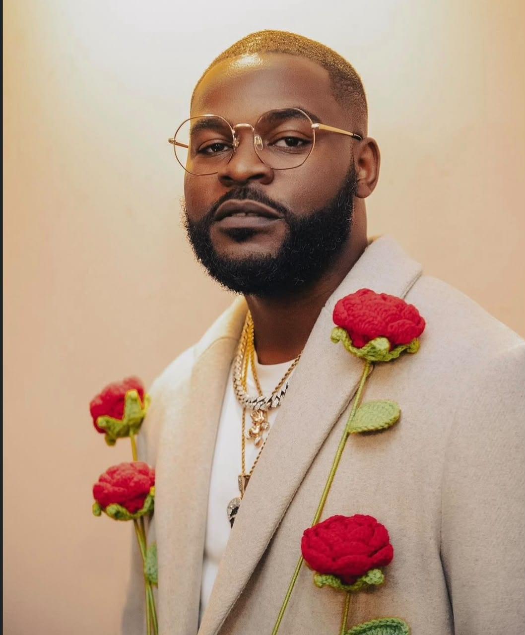 Portrait detail of the custom overcoat with hand-crocheted 3D roses